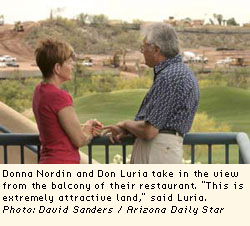 Donna Nordin and Don Luria take in the view from the balcony of their restaurant. "This is extremely attractive land," said Luria.